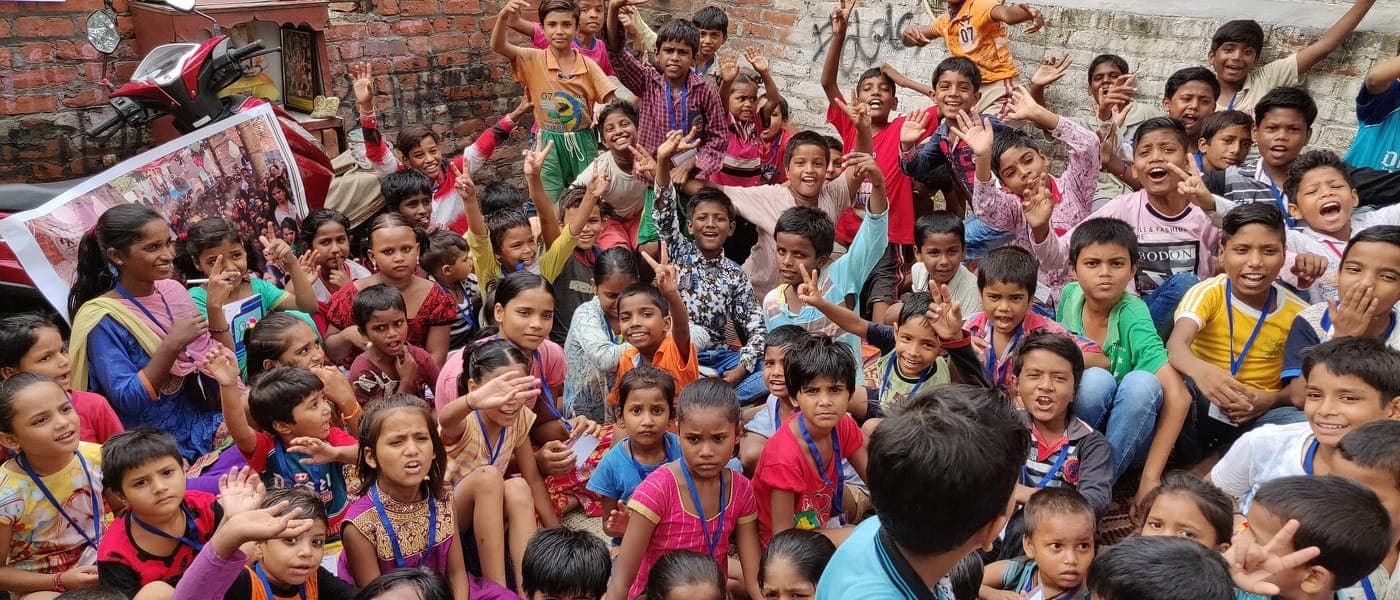 Children gathered at an open-air street-school programme in Delhi.